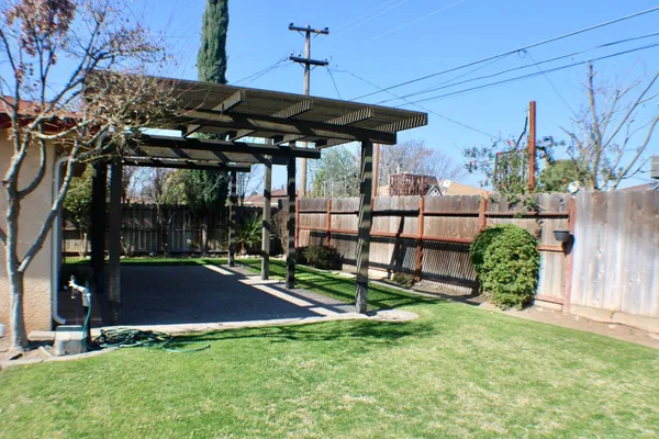 a view of a backyard with a patio