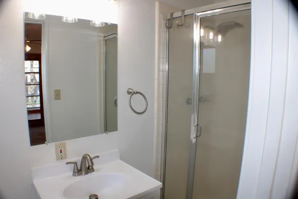 a bathroom with a sink and mirror