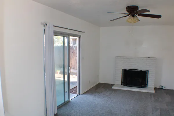 a view of empty room with fireplace