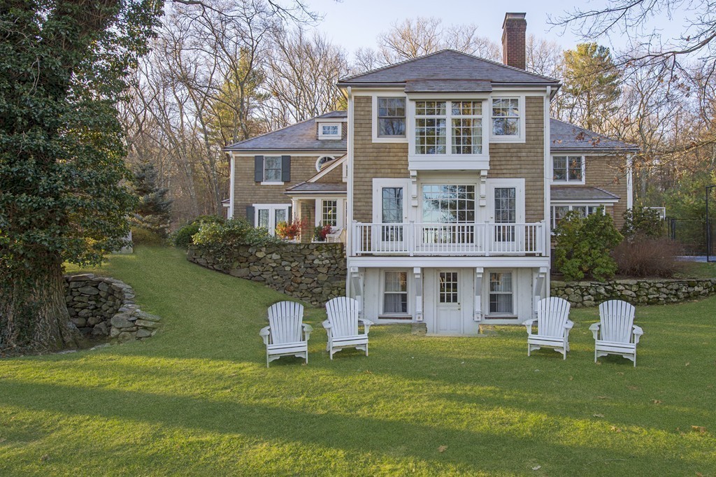 90 Meadowbrook Road Weston, MA 02493 - Photo 5 of 30 a front view of a house with a garden