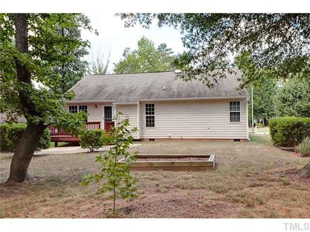 502 Windcrest Road Durham, NC 27713 - Photo 18 of 21 There is a patio off of the deck. This planting plot is ready for the gardner. Back Yard