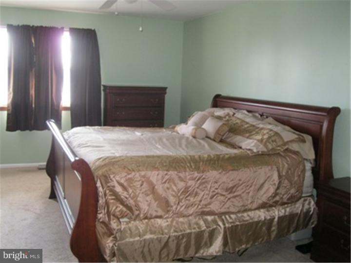 2902 Daniel Drive Sinking Spring, PA 19608 - Photo 13 of 24 a bedroom with a bed and a window