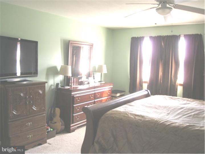 2902 Daniel Drive Sinking Spring, PA 19608 - Photo 14 of 24 a bedroom with a bed and a cabinets