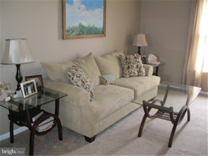 2902 Daniel Drive Sinking Spring, PA 19608 - Photo 4 of 24 a living room with furniture and a lamp