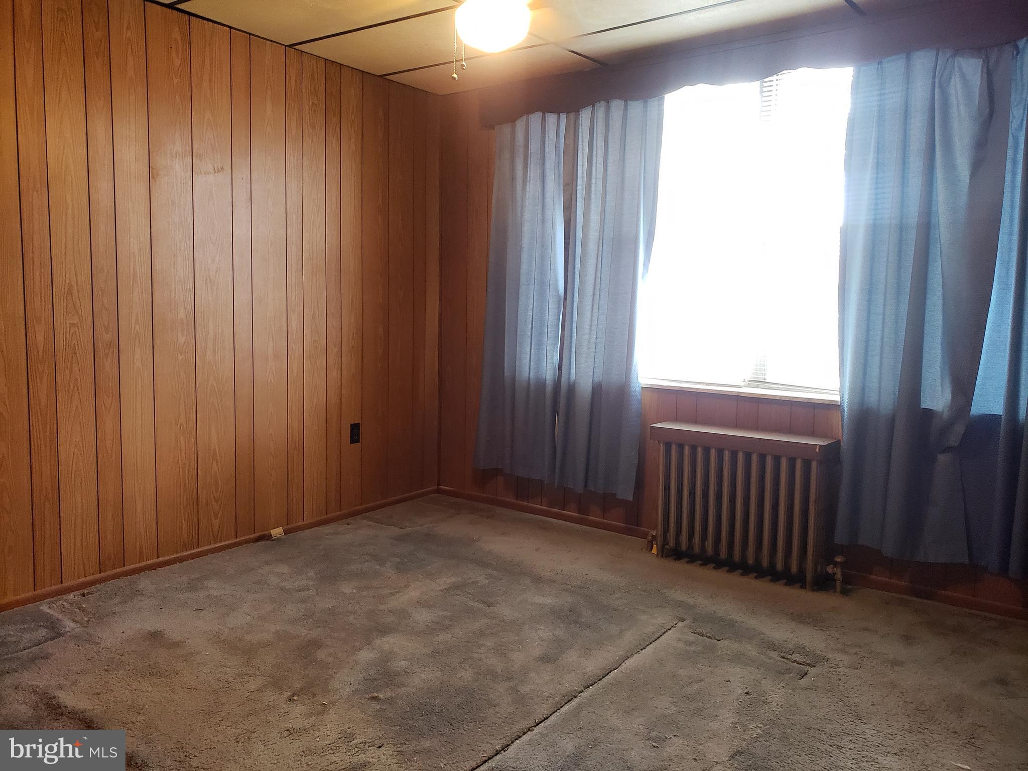 2436 West Ritner Street Philadelphia, PA 19145 - Photo 32 of 64 Front Bedroom (original wood floor under carpet)