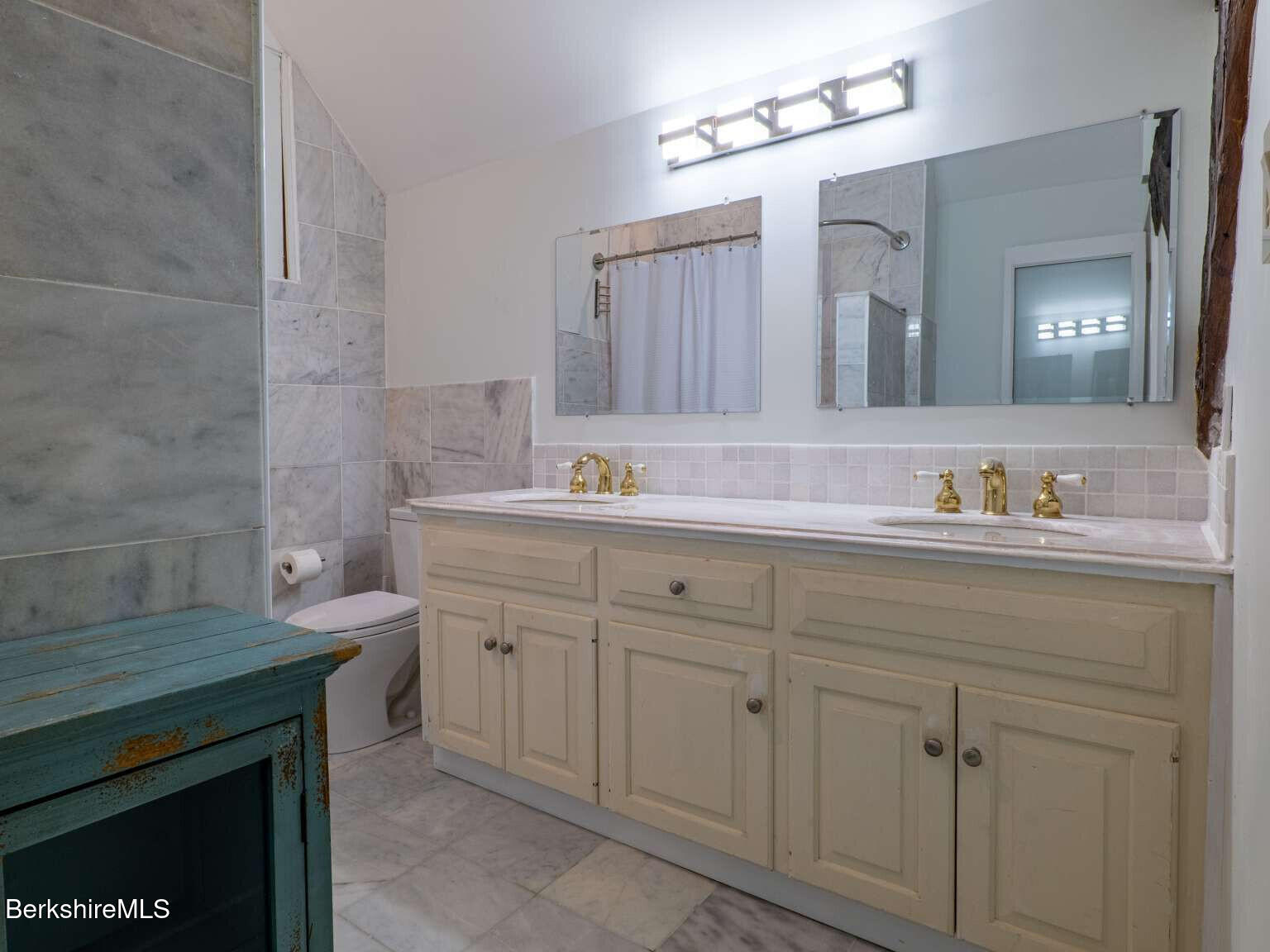 160 High Street Lee, MA 01238 - Photo 35 of 41 a bathroom with a sink and a mirror