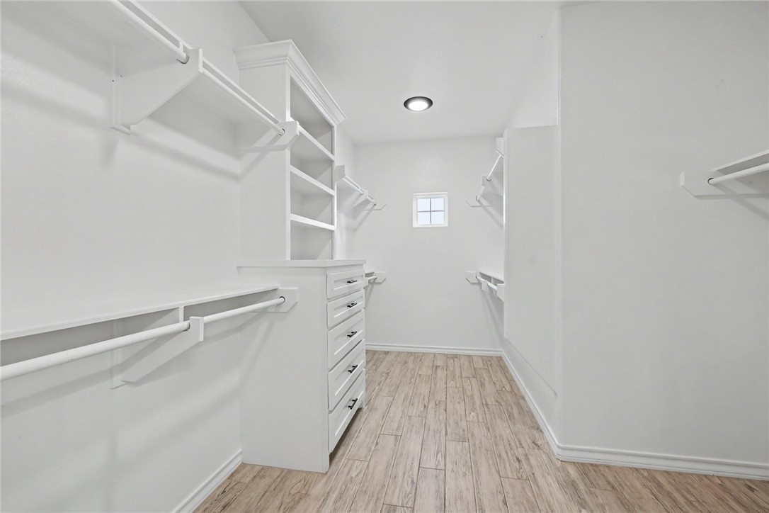 143 Amethyst Street Portland, TX 78374 - Photo 14 of 26 a view of walk in closet with empty racks