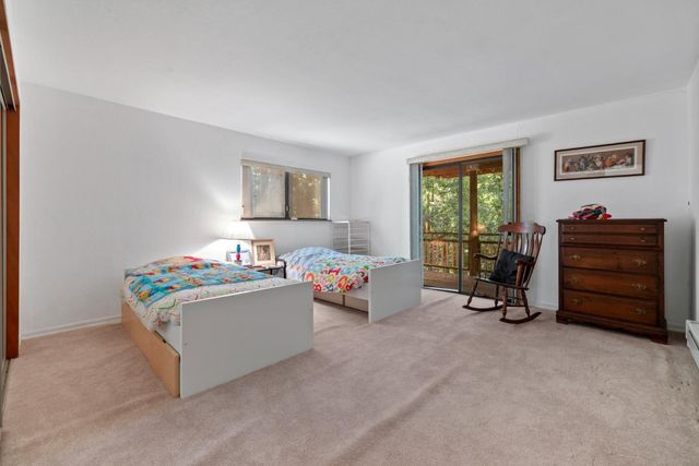 a living room with furniture and a bed