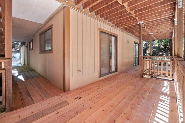 a view of a house with wooden floor and chair