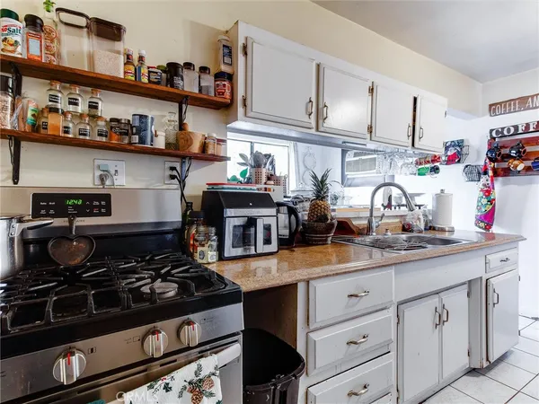 a kitchen with lots of counter top space and cabinets