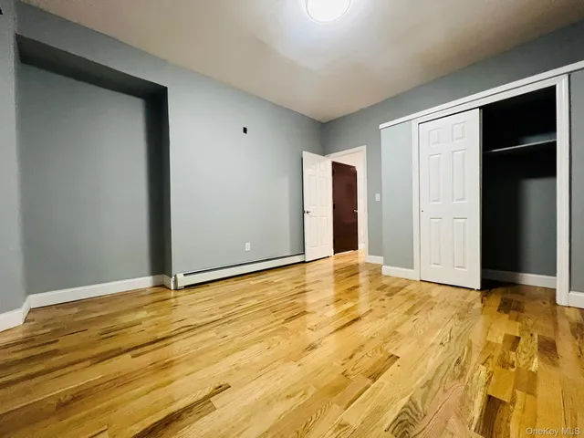 a view of kitchen with stainless steel appliances granite countertop a stove top oven a refrigerator and a sink