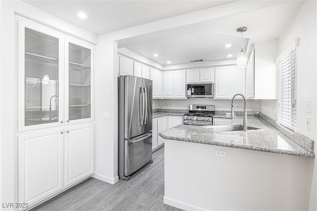 10133 Rice Paper Street Las Vegas, NV 89183 - Photo 13 of 36 Kitchen featuring NEW LG stainless steel appliances, Granite counters, New Pendant Lights, New Ceiling w/recessed Lighting