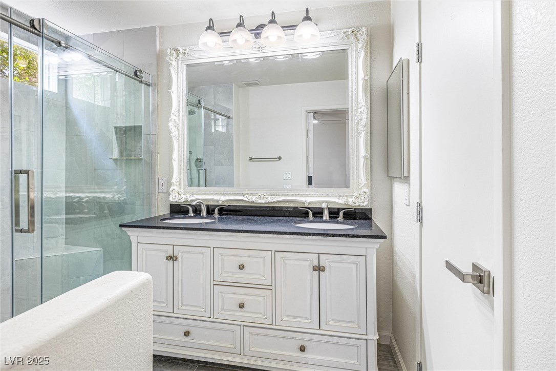 10133 Rice Paper Street Las Vegas, NV 89183 - Photo 22 of 36 Full bath featuring NEW double vanity and NEW Kohler Toilet