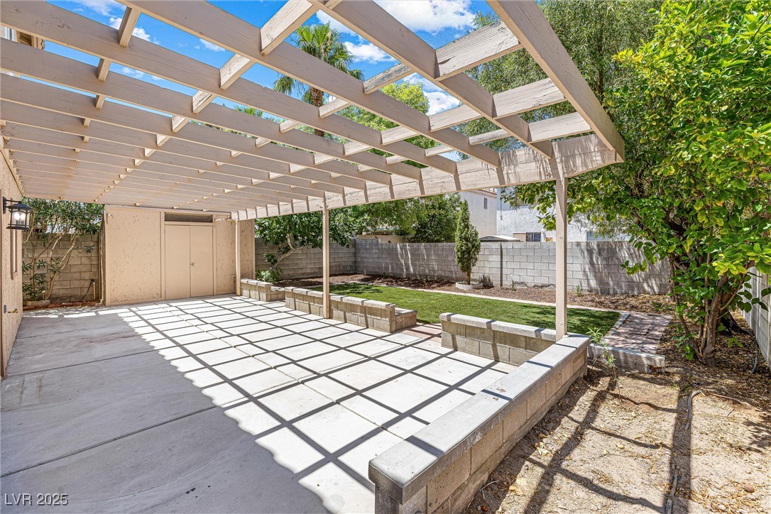 10133 Rice Paper Street Las Vegas, NV 89183 - Photo 33 of 36 Stunning Backyard, pergola, NEW Luxury Turf, Mature Trees, SHED