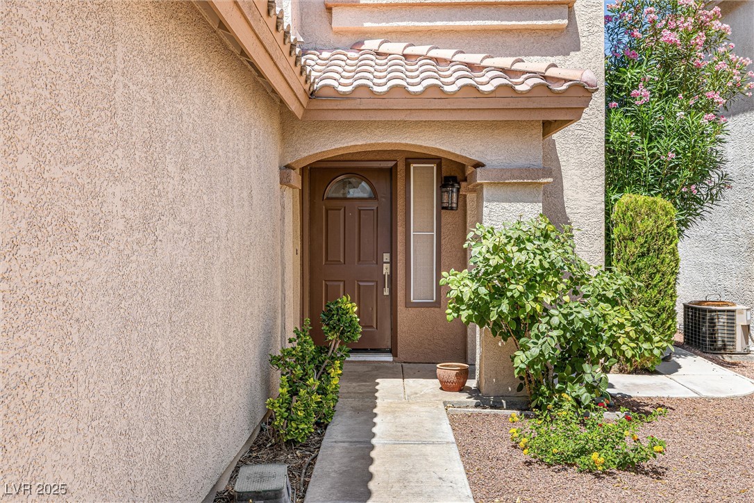 10133 Rice Paper Street Las Vegas, NV 89183 - Photo 5 of 36 New Front Door Features+ Kwikset Lock+Lighting