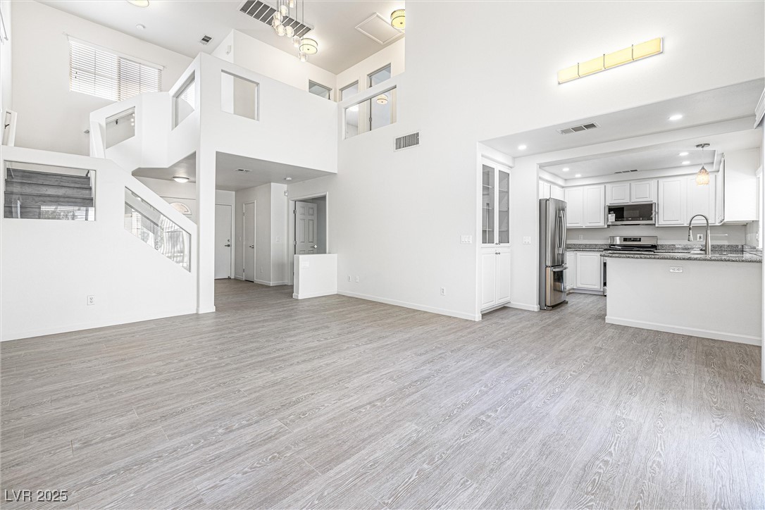 10133 Rice Paper Street Las Vegas, NV 89183 - Photo 7 of 36 New Paint, New Baseboards, towering ceiling