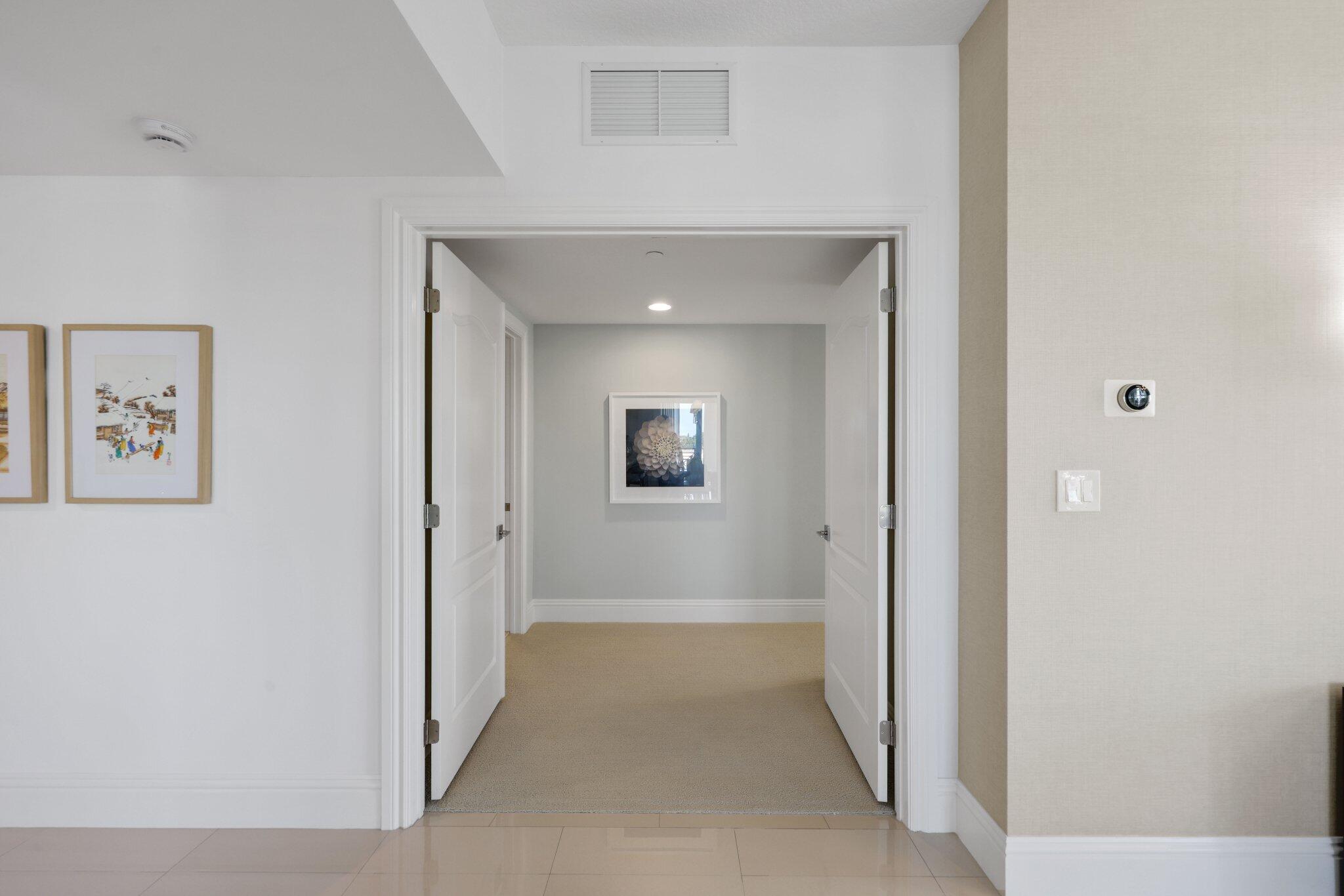 200 East Palmetto Park Road, Unit 505 Boca Raton, FL 33432 - Photo 23 of 71 a view of a hallway with wooden floor
