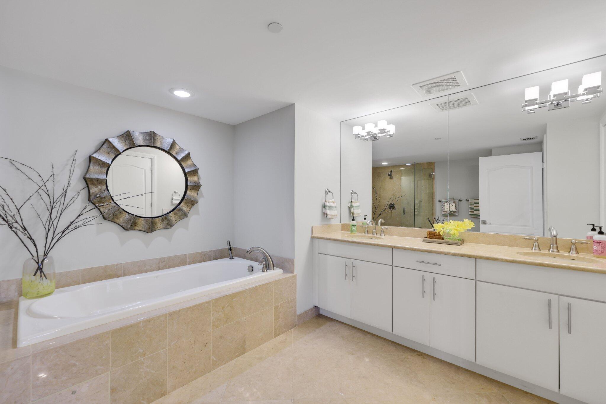 200 East Palmetto Park Road, Unit 505 Boca Raton, FL 33432 - Photo 29 of 71 a spacious bathroom with a double vanity sink and a mirror