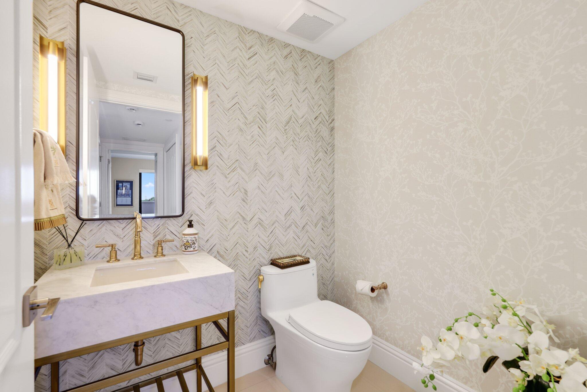 200 East Palmetto Park Road, Unit 505 Boca Raton, FL 33432 - Photo 33 of 71 a bathroom with a granite countertop sink a toilet and a mirror