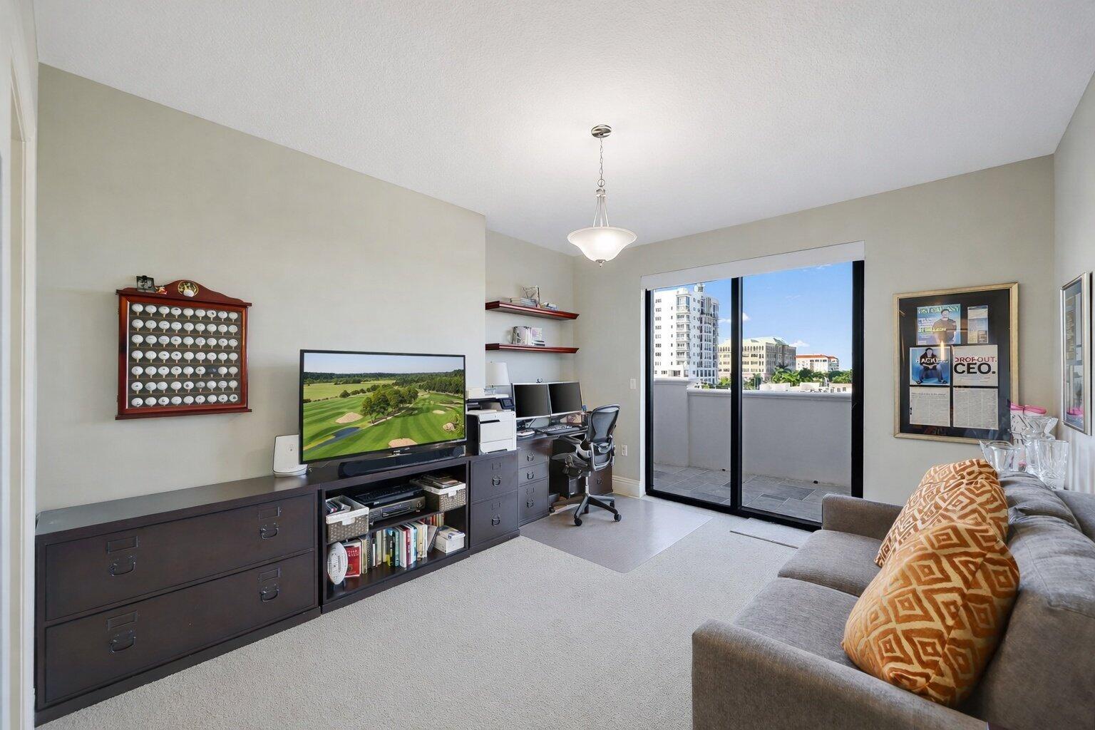 200 East Palmetto Park Road, Unit 505 Boca Raton, FL 33432 - Photo 36 of 71 a living room with furniture and a flat screen tv