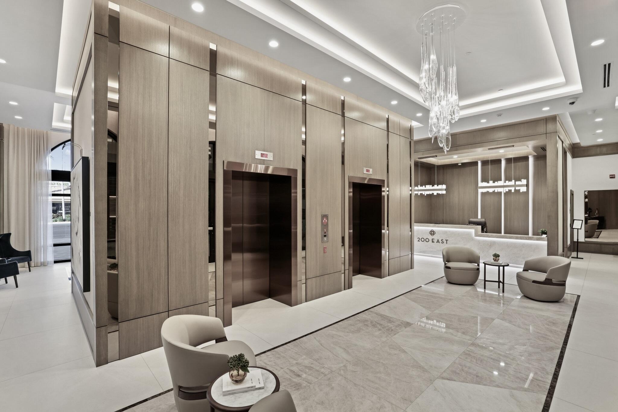 200 East Palmetto Park Road, Unit 505 Boca Raton, FL 33432 - Photo 49 of 71 a spacious bathroom with a double vanity sink a toilet a mirror and shower