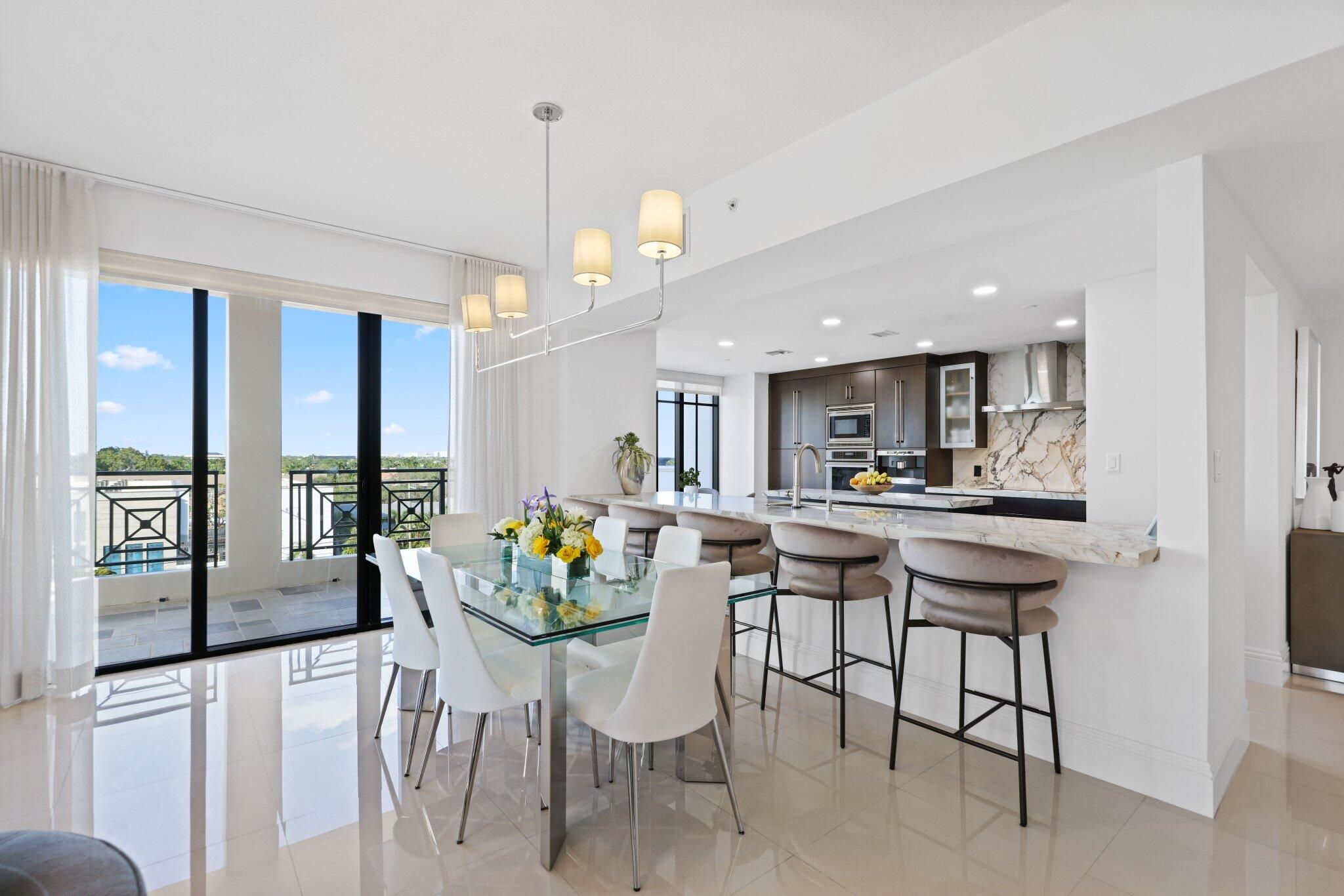 200 East Palmetto Park Road, Unit 505 Boca Raton, FL 33432 - Photo 9 of 71 a view of a dining room with furniture and a potted plant