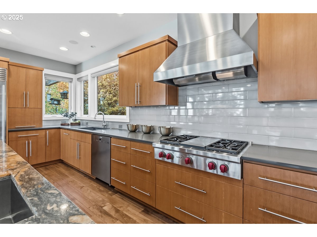 32047 Northeast Corral Creek Road Newberg, OR 97132 - Photo 11 of 40 a kitchen with stainless steel appliances granite countertop a sink stove and window