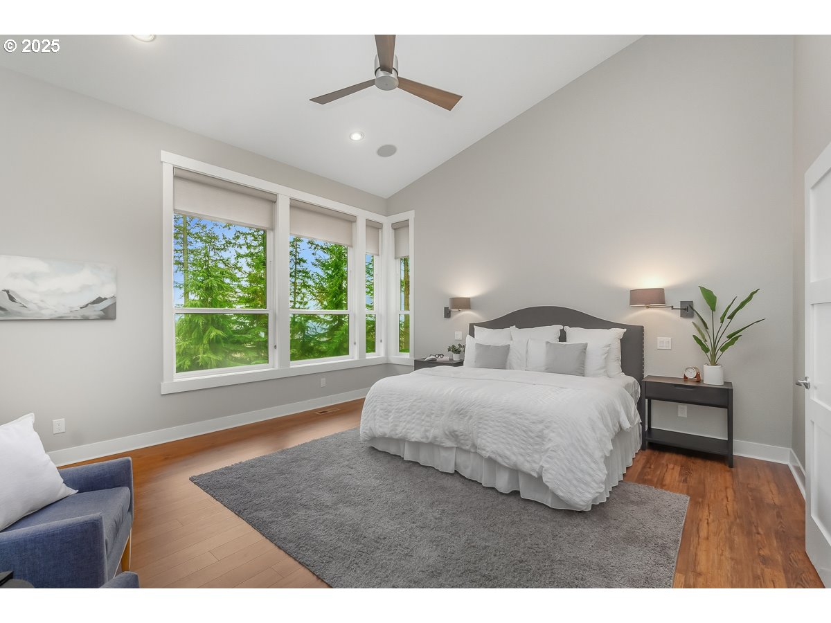 32047 Northeast Corral Creek Road Newberg, OR 97132 - Photo 15 of 40 a bedroom with a large bed and a window