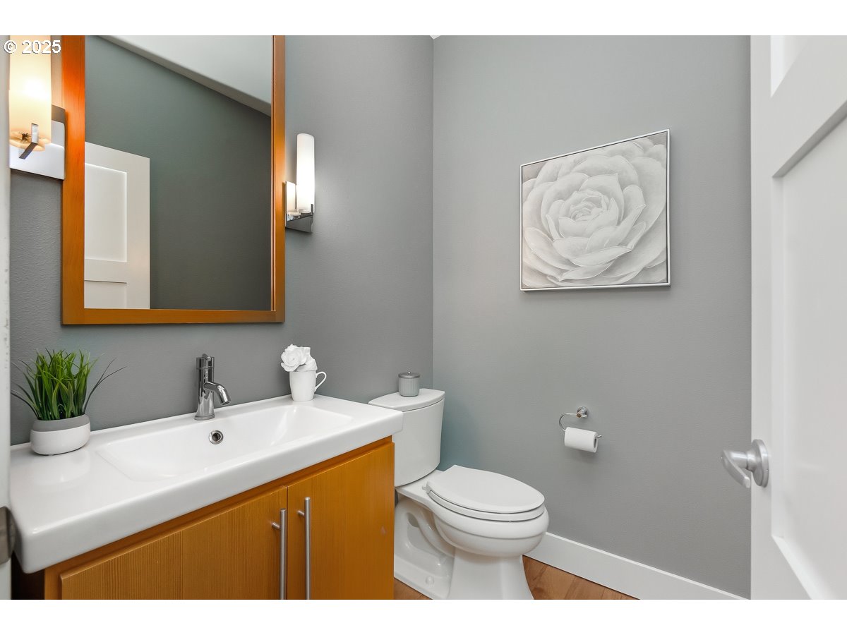 32047 Northeast Corral Creek Road Newberg, OR 97132 - Photo 24 of 40 a bathroom with a toilet sink and mirror