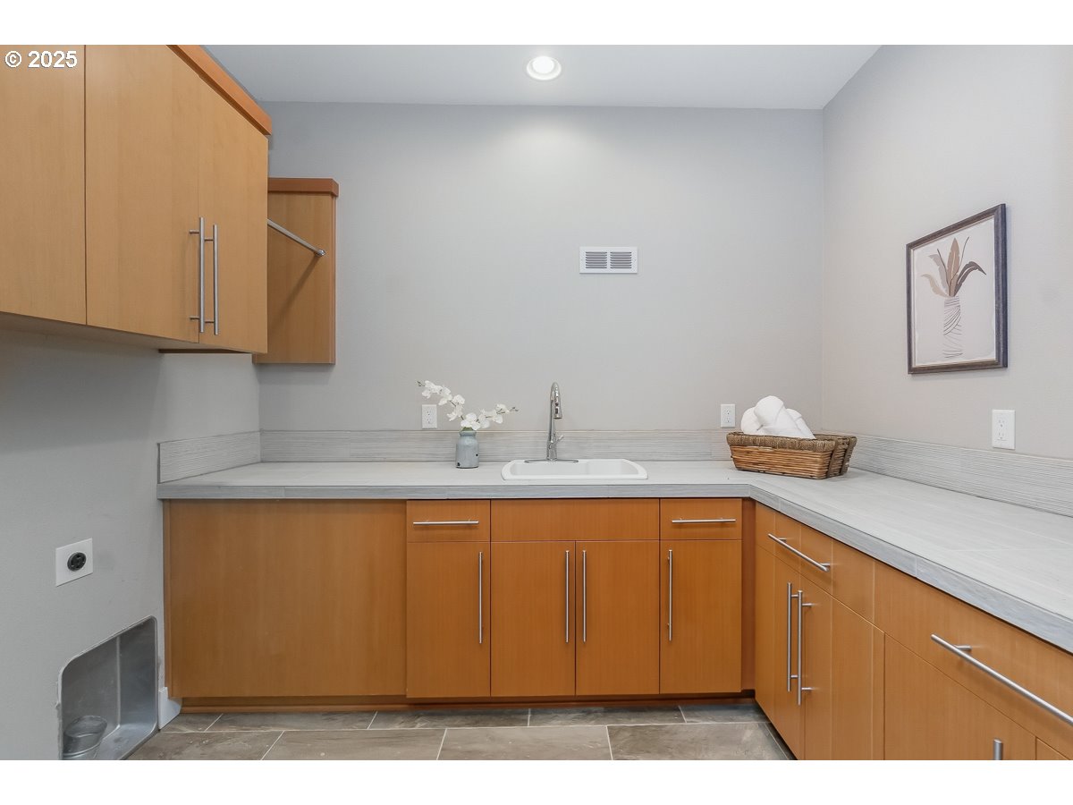 32047 Northeast Corral Creek Road Newberg, OR 97132 - Photo 25 of 40 a kitchen with a sink and cabinets