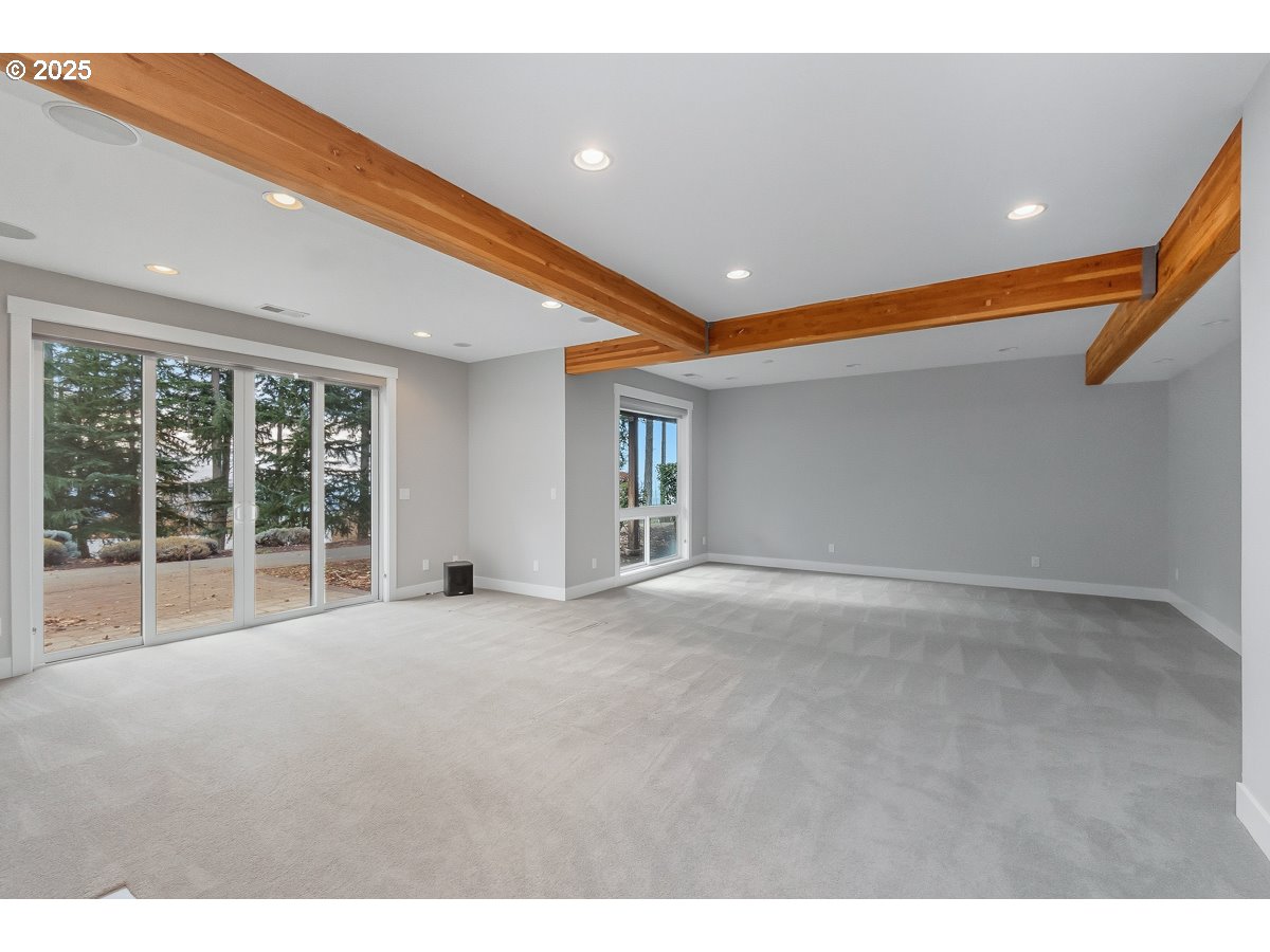 32047 Northeast Corral Creek Road Newberg, OR 97132 - Photo 26 of 40 a view of an empty room with windows