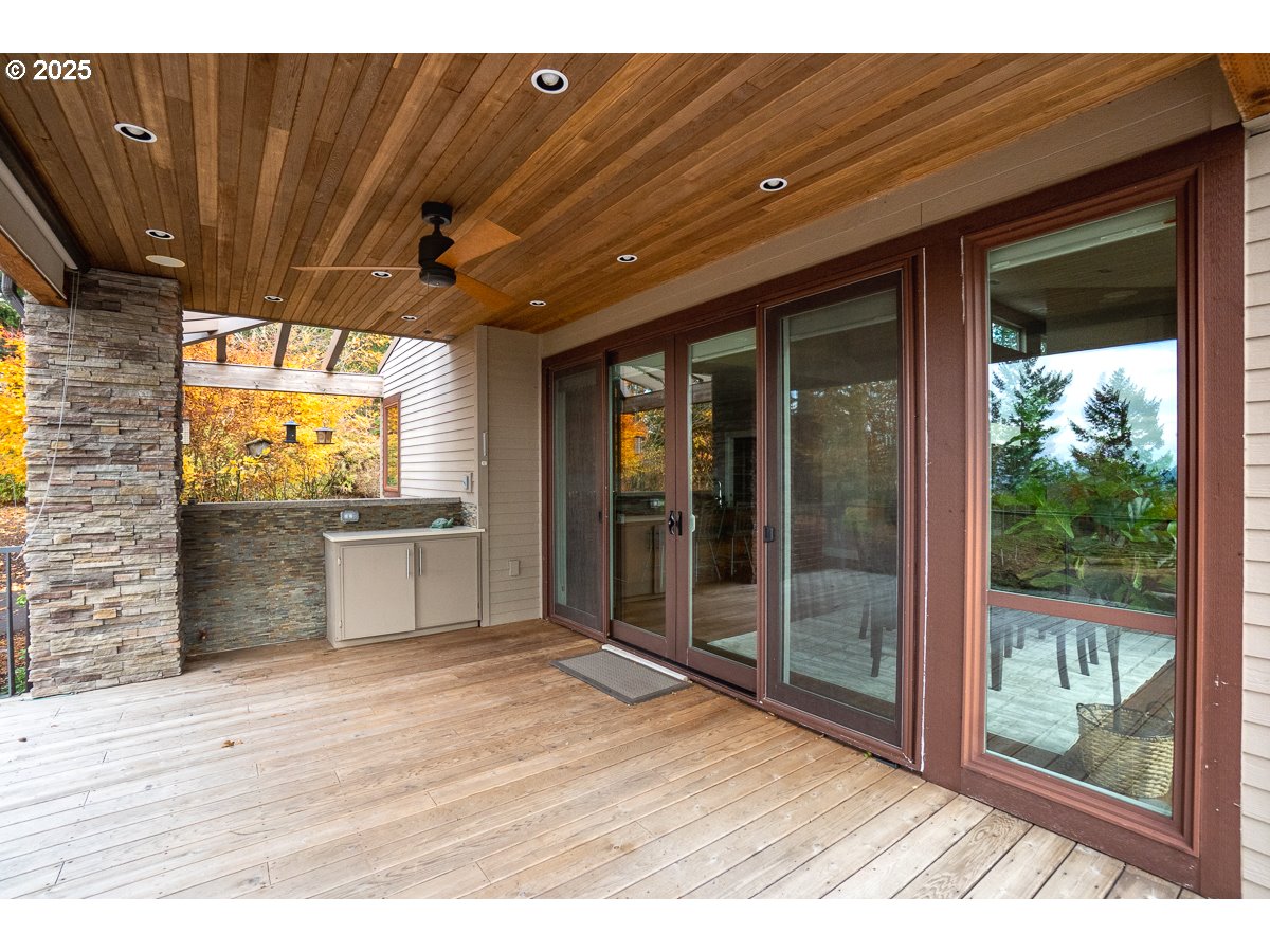 32047 Northeast Corral Creek Road Newberg, OR 97132 - Photo 36 of 40 a view of a room with wooden floor and windows