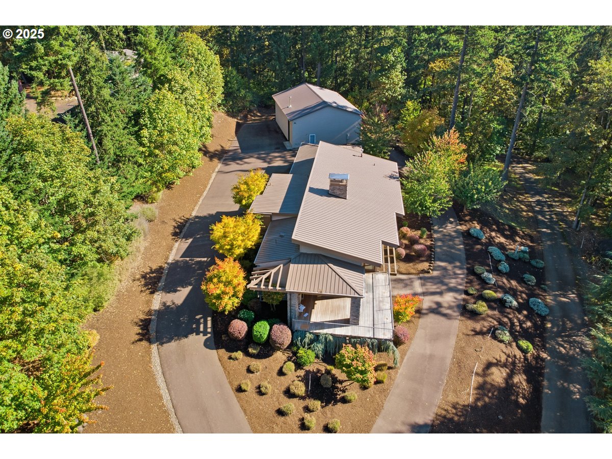 32047 Northeast Corral Creek Road Newberg, OR 97132 - Photo 37 of 40 a view of a house with a yard and sitting area