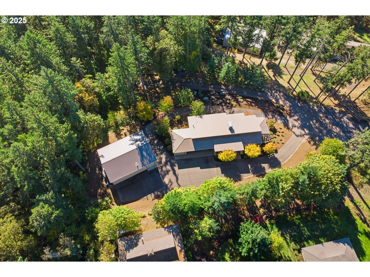 32047 Northeast Corral Creek Road Newberg, OR 97132 - Photo 4 of 40 a view of a house with a garden
