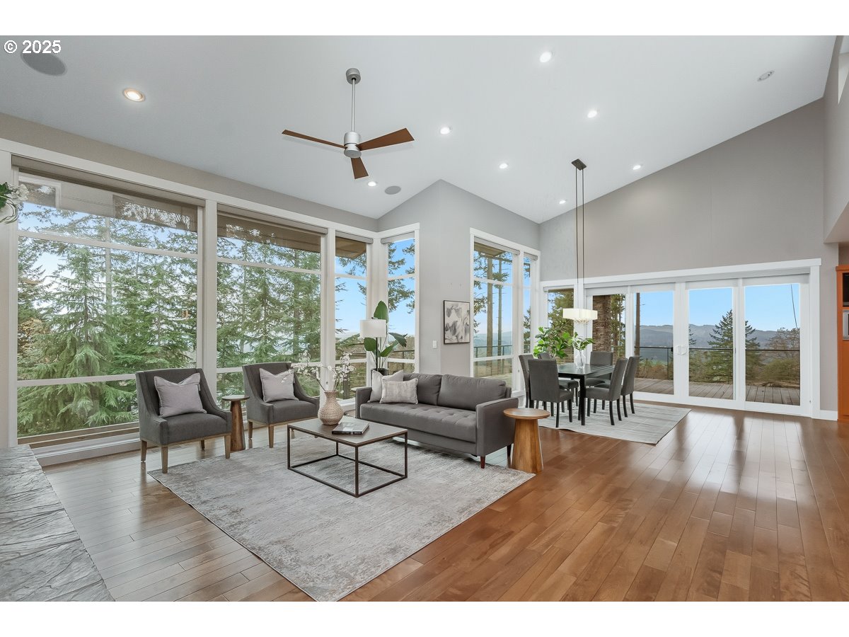 32047 Northeast Corral Creek Road Newberg, OR 97132 - Photo 5 of 40 a living room with furniture and a large window