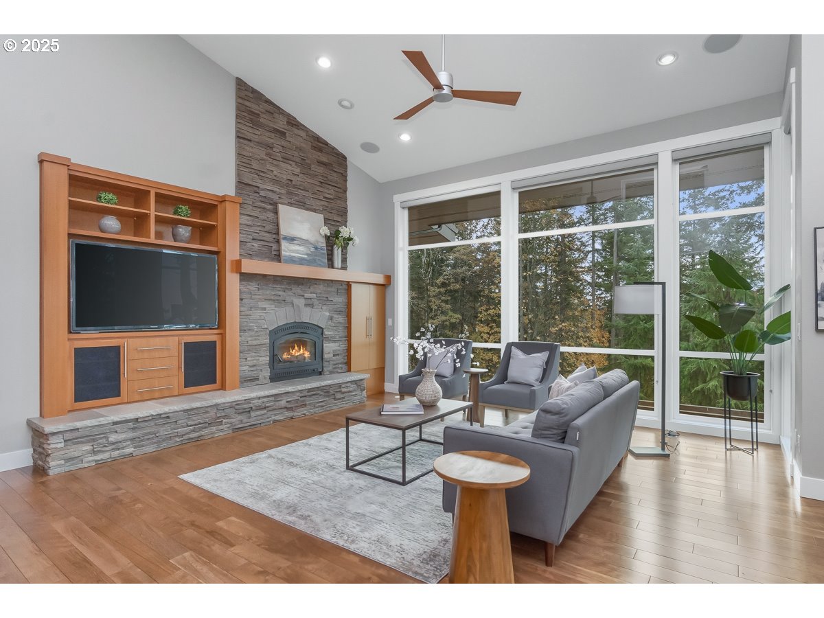32047 Northeast Corral Creek Road Newberg, OR 97132 - Photo 6 of 40 a living room with furniture and a fireplace