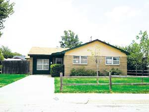 5205 South Austin Street Amarillo, TX 79110 - Photo 1 of 1 a view of a house next to a yard with big trees