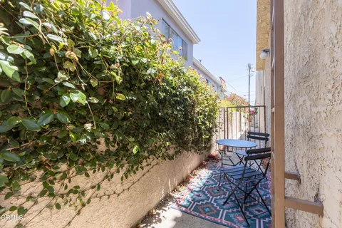 a house with table and chairs in patio