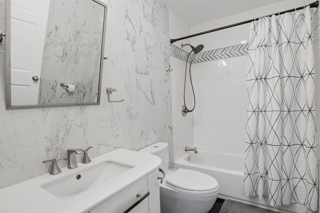 112 Pineland Avenue Worcester, MA 01604 - Photo 22 of 38 a bathroom with a sink toilet and shower