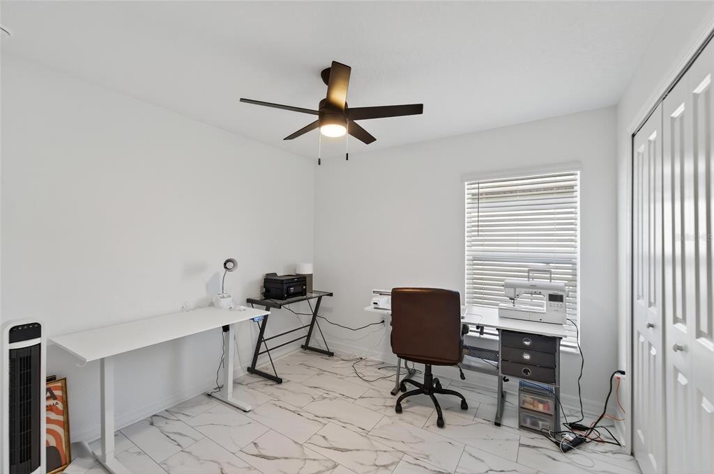 13073 Garnet Raspberry Avenue Wimauma, FL 33598 - Photo 15 of 50 a view of a workspace with furniture