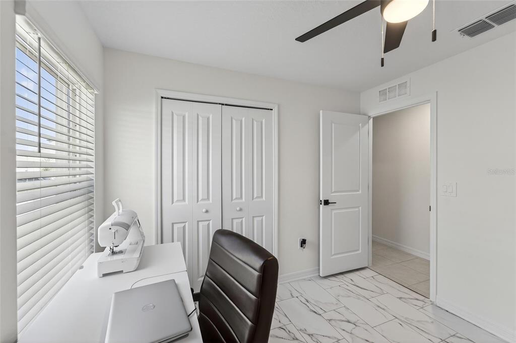 13073 Garnet Raspberry Avenue Wimauma, FL 33598 - Photo 16 of 50 a room with furniture and wooden floor