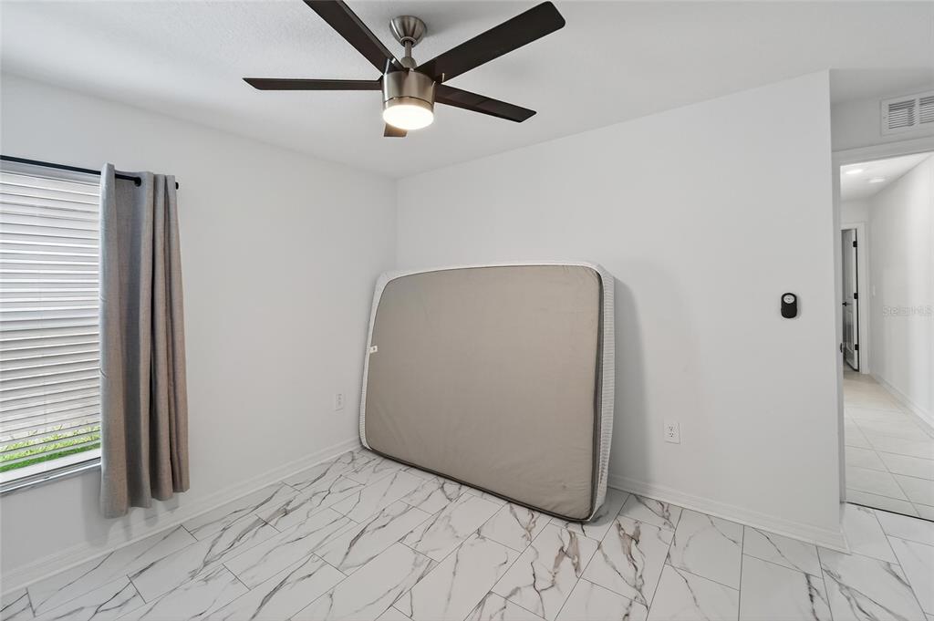 13073 Garnet Raspberry Avenue Wimauma, FL 33598 - Photo 21 of 50 a view of a hallway with a workspace