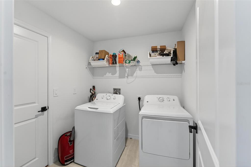 13073 Garnet Raspberry Avenue Wimauma, FL 33598 - Photo 44 of 50 a utility room with dryer and washer