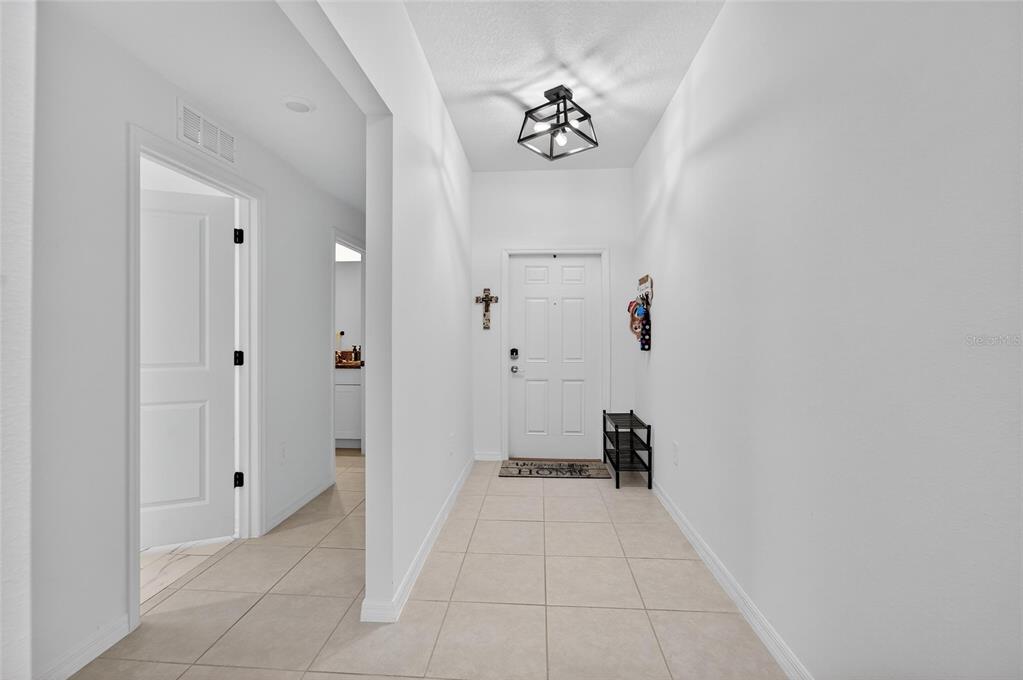 13073 Garnet Raspberry Avenue Wimauma, FL 33598 - Photo 7 of 50 a view of a hallway with closet