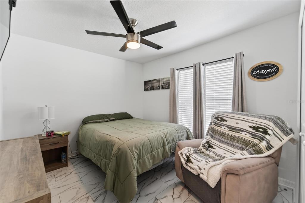 13073 Garnet Raspberry Avenue Wimauma, FL 33598 - Photo 8 of 50 a bedroom with a bed and a window