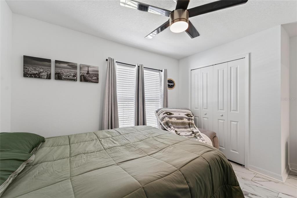 13073 Garnet Raspberry Avenue Wimauma, FL 33598 - Photo 10 of 50 a bedroom with a bed and a window