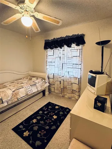 a kitchen with stove and cabinets