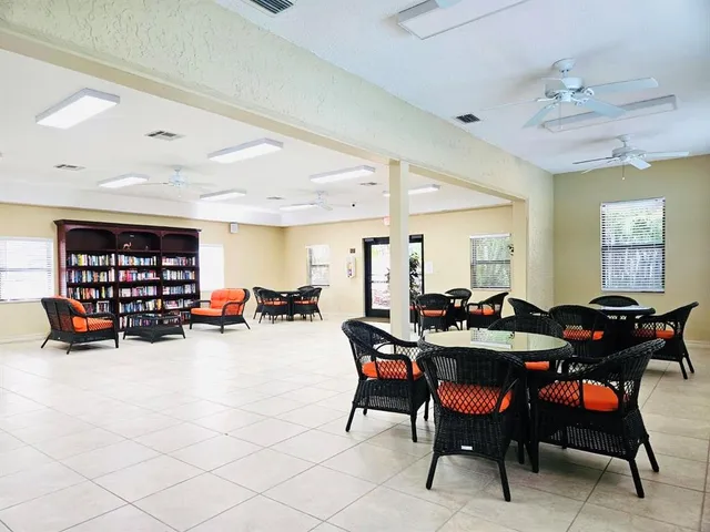 a view of a dining area with furniture and chandelier