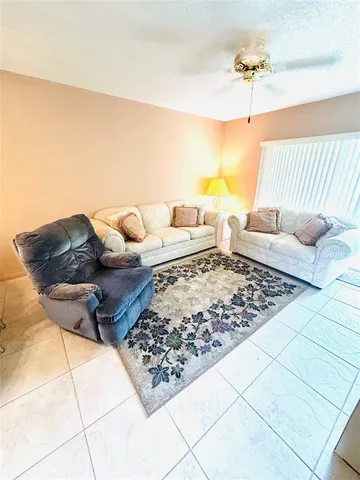 a living room with lots of couch and a rug