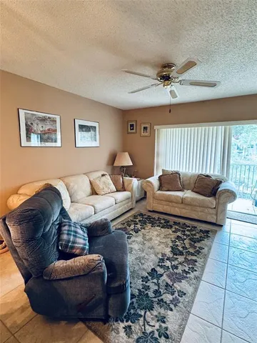 a living room with furniture and a rug